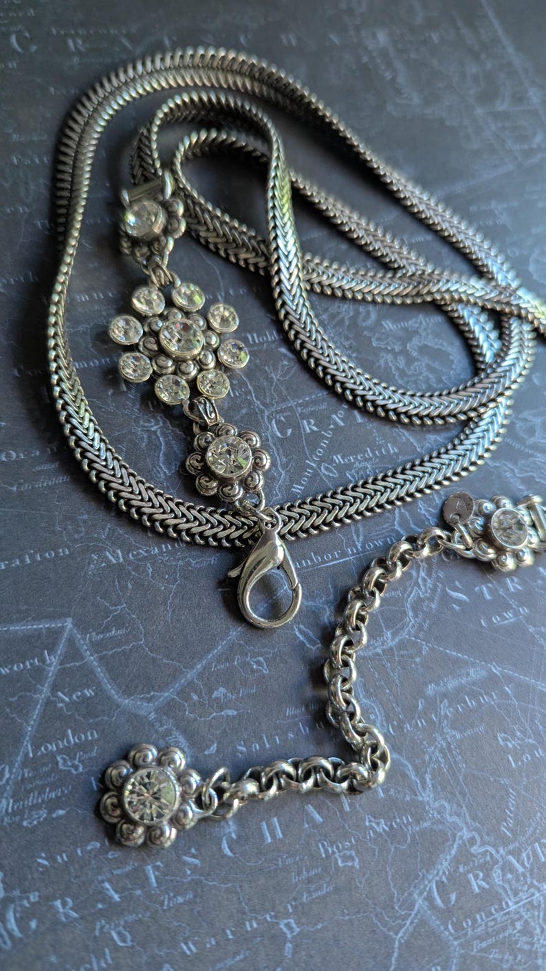 Vintage Brighton style silver-tone chain belt with flowers crystal station details and lobster clasp, XL length measuring up to 43 inches end to end.