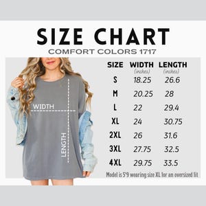 May include: A size chart for Comfort Colors 1717 t-shirts. The chart shows measurements in inches for sizes S through 4XL. The model in the image is wearing an XL for an oversized fit. The shirt is gray.