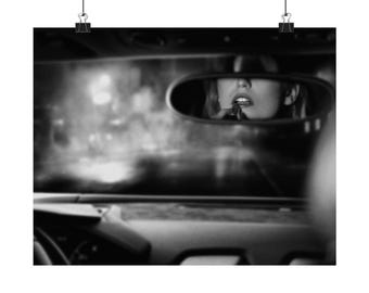 Film Noir Poster: Femme Fatale in Car Rearview Mirror
