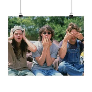 May include: A poster featuring three people in a 'hear no evil, speak no evil, see no evil' pose. One covers their ears, another their mouth, and the third their eyes. They are wearing casual clothing.