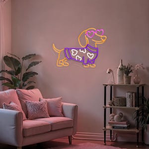 K&ouml;nnte beinhalten: Ein Neon-Schild mit einem Dackel, der eine Herz-Sonnenbrille und einen lila Pullover mit wei&szlig;en Herzen tr&auml;gt. Das Schild leuchtet in Orange und Lila.