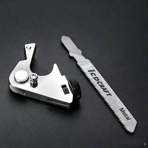 May include: A silver metal hand saw handle with a black adjustment knob and a detachable metal saw blade. The blade features the text ICD CRAFT and Metal printed on its surface. The tool is designed for precision cutting tasks with a serrated edge.