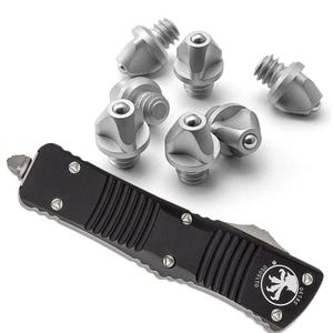 May include: A black rectangular handle with a textured grip and a circular logo featuring a claw design, accompanied by six silver-colored metal studs. Each stud has a threaded base and a rounded top with a small embedded ball bearing component.