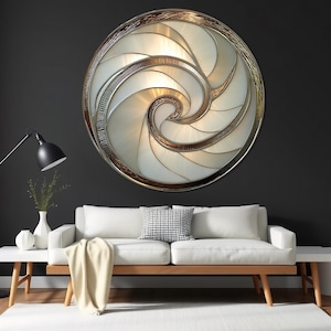 May include: A large, round wall light fixture with a spiral design. The fixture features a silver and bronze frame, with white and cream-colored panels. The light is mounted on a dark gray wall above a white sofa.