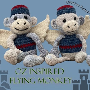 May include: Two plush, crochet flying monkeys with white wings, wearing blue and red striped vests and caps. The text "OZ INSPIRED FLYING MONKEY" is at the bottom of the image, with "Crochet Pattern Only" at the top.