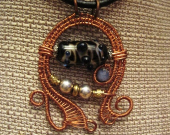Mixed metal wire woven lampwork organic swirling pendant