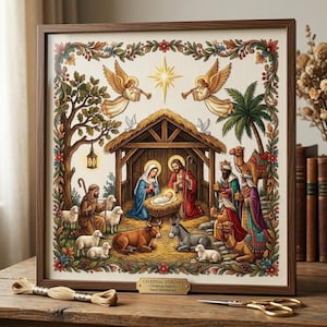 May include: A framed cross-stitch nativity scene featuring a central stable with figures, angels, and animals, surrounded by a floral border. A small gold plaque reads CELESTIAL STITCHES - Christmas Nativity - Hand-Stitched Art.