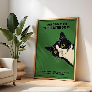 Funny tuxedo cat bathroom print — green framed decorative poster with a black-and-white cat; perfect restroom wall art for cat lovers.