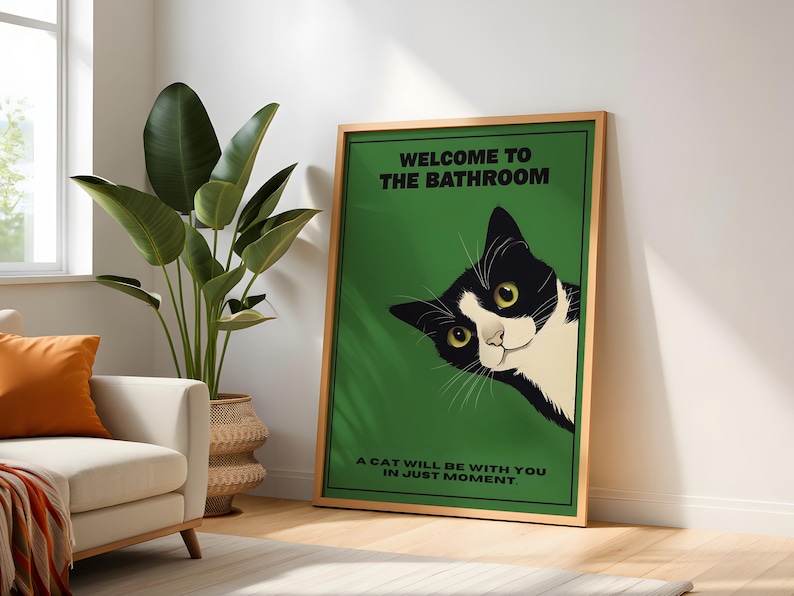 Funny tuxedo cat bathroom print — green framed decorative poster with a black-and-white cat; perfect restroom wall art for cat lovers.