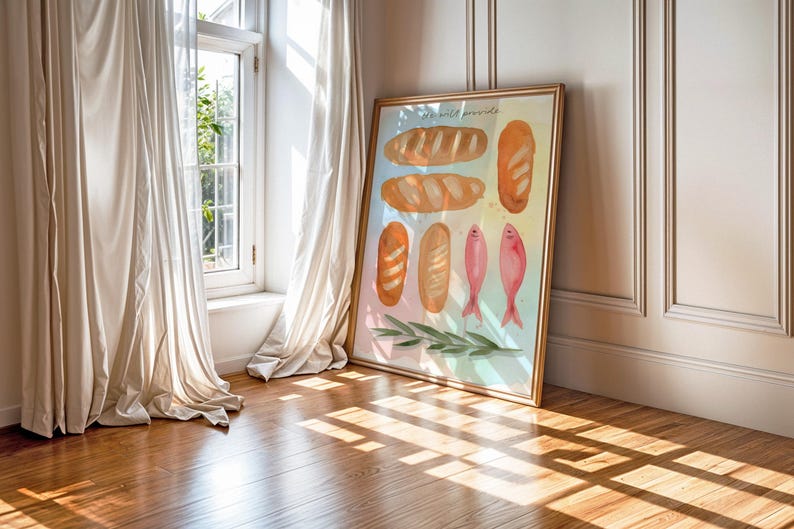 May include: A framed watercolour print depicting different types of bread and pink fish. The gold-coloured frame leans against a wall. The artwork includes the text "We will provide".