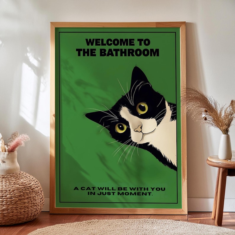 Funny tuxedo cat bathroom print — green framed decorative poster with a black-and-white cat; perfect restroom wall art for cat lovers.