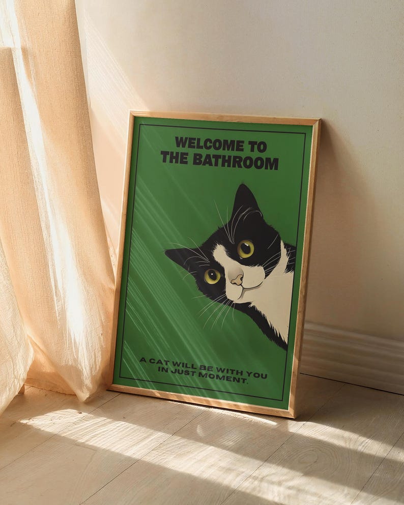 Funny tuxedo cat bathroom print — green framed decorative poster with a black-and-white cat; perfect restroom wall art for cat lovers.