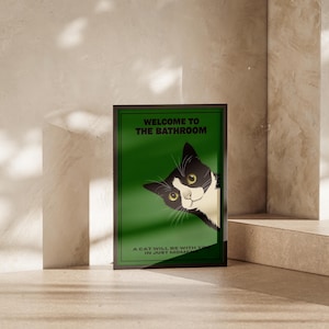 Funny tuxedo cat bathroom print — green framed decorative poster with a black-and-white cat; perfect restroom wall art for cat lovers.