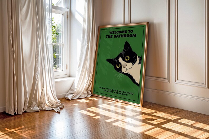 Funny tuxedo cat bathroom print — green framed decorative poster with a black-and-white cat; perfect restroom wall art for cat lovers.