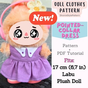 May include: A plush Labu doll in a purple pointed-collar dress, with a flower and pink headphones. The image includes text: "DOLL CLOTHES PATTERN" and "POINTED-COLLAR DRESS". The pattern fits a 17 cm doll.
