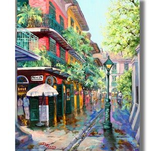 Print of a vibrant New Orleans French Quarter scene, Pirates Alley is depicted with colorful buildings adorned with balconies and lush greenery.