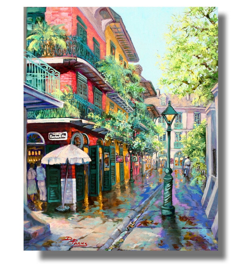 Print of a vibrant New Orleans French Quarter scene, Pirates Alley is depicted with colorful buildings adorned with balconies and lush greenery.
