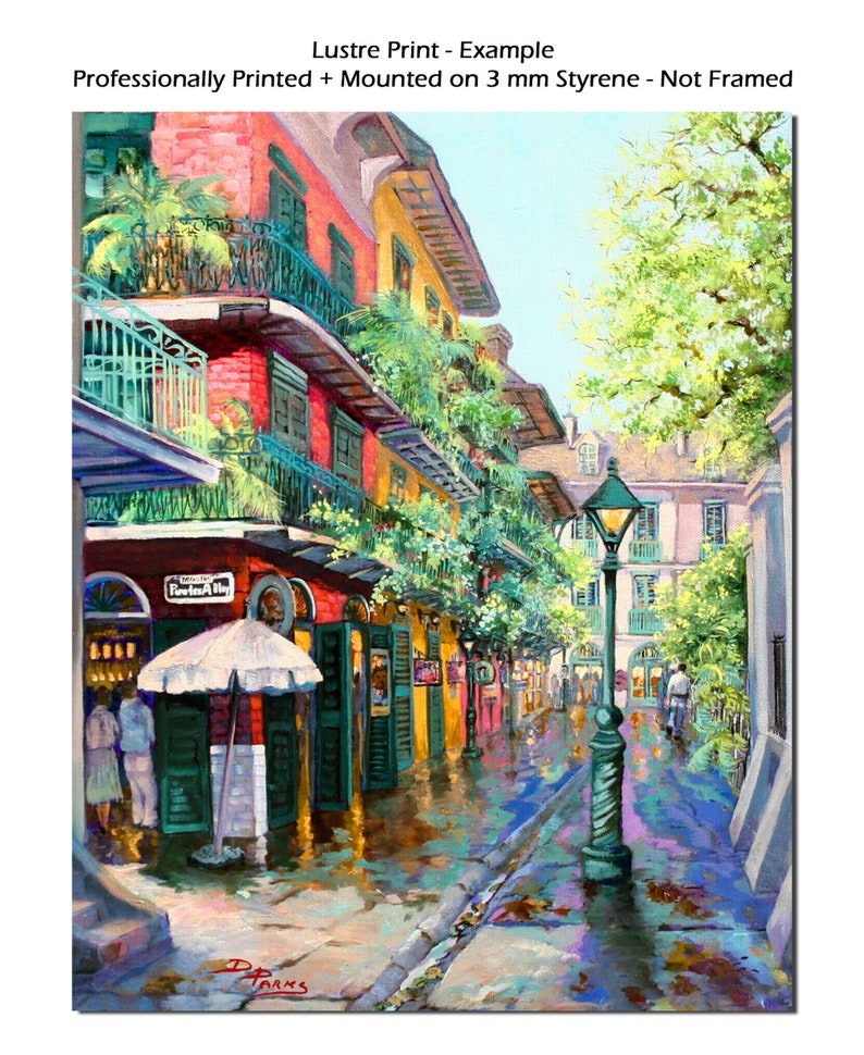 Print view of a vibrant New Orleans French Quarter scene, Pirates Alley is depicted with colorful buildings adorned with balconies and lush greenery.