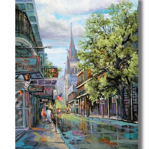 May include: A painting of a street scene in New Orleans, Louisiana. The street is lined with buildings with balconies and shops. A large tree with green leaves shades the street. A church steeple is visible in the distance. The street is wet from recent rain.