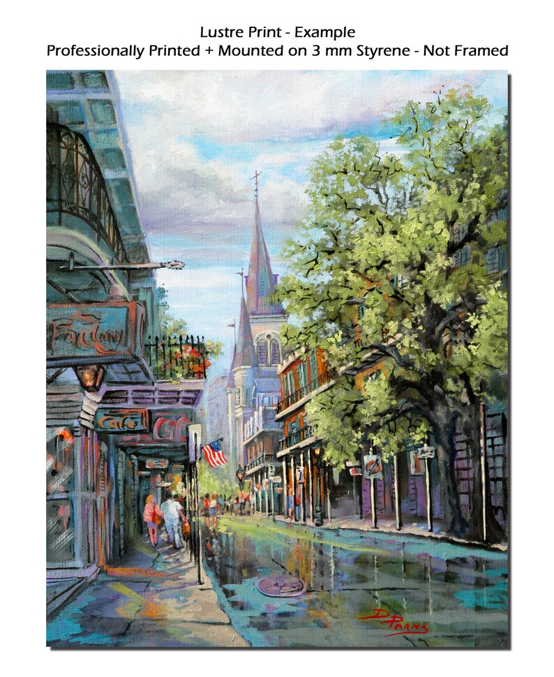 May include: A painting of a street scene in New Orleans, Louisiana. The street is lined with buildings, some of which have balconies. There is a large tree in the middle of the street, and a church steeple in the background. The street is wet from rain, and there are people walking on the sidewalk.