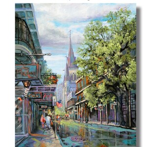 May include: A painting of a street scene in New Orleans, Louisiana. The street is lined with buildings, some of which have balconies. There is a large tree in the center of the street, and a church steeple in the background. The street is wet from rain, and there are reflections of the buildings and trees in the puddles.