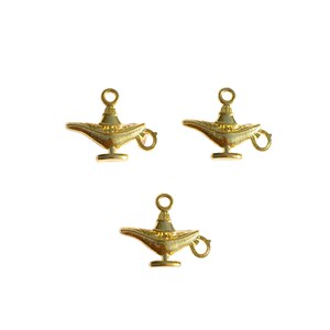 May include: Three gold-coloured genie lamp charms with a loop for attaching to a necklace or bracelet.