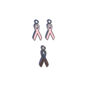 May include: Three metal ribbon charms, two pink and one silver. The pink ribbons are enamel and the silver ribbon is plain metal.