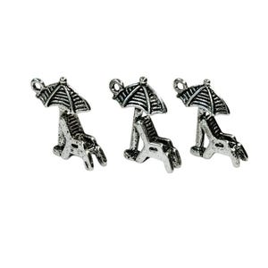 May include: Three silver-toned charms in the shape of a beach chair with an umbrella. The charms are perfect for adding a summery touch to jewelry or crafts.