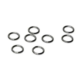 May include: A collection of seven small, circular metal jump rings. Each ring features a smooth, dark grey finish and a single visible split point along the circumference, indicating they are designed for connecting jewelry components together.