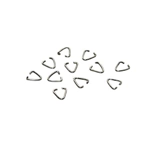 May include: A group of 15 silver triangle-shaped metal rings. The rings are small and have a smooth finish.