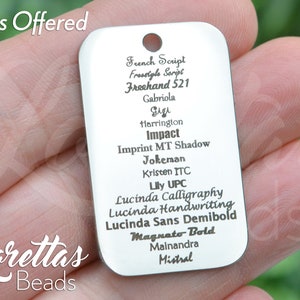 May include: A silver metal tag with a list of fonts, including French Script, Freestyle Script, Freehand 521, Gabriola, Gigi, Harrington, Impact, Imprint MT Shadow, Jokeman, Kristen ITC, Lily UPC, Lucinda Calligraphy, Lucinda Handwriting, Lucinda Sans Demibold, Magnato Bold, Mainandra, and Mistral.