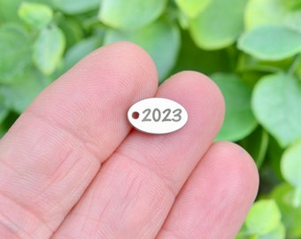 Year 2023, Stainless Steel  Custom Laser Engraved  Oval Charm CC103