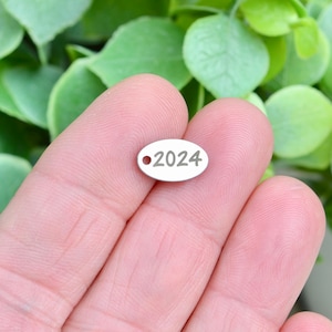 Year 2024, Stainless Steel  Custom Laser Engraved  Oval Charm CC180