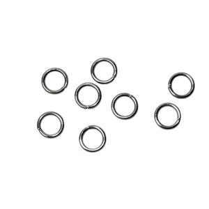 May include: A collection of seven small, circular silver-toned metal jump rings. Each ring features a single thin opening along its circumference, designed for connecting jewelry components. The rings are arranged in a loose, scattered formation.