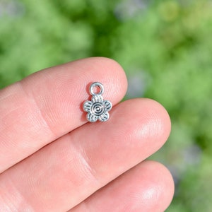 10 Flower Silver Tone Charms SC2888