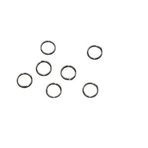 May include: A set of eight silver jump rings, scattered on a white background.
