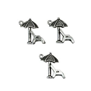 May include: Three silver charm pendants featuring a beach chair and umbrella design. The charms are perfect for adding a summery touch to jewelry.