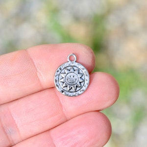 10  Sun Silver Tone Charms SC6548
