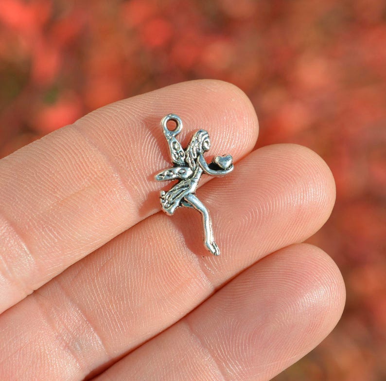 BULK 50 Fairy holding a Heart Silver Tone Charms SC6522