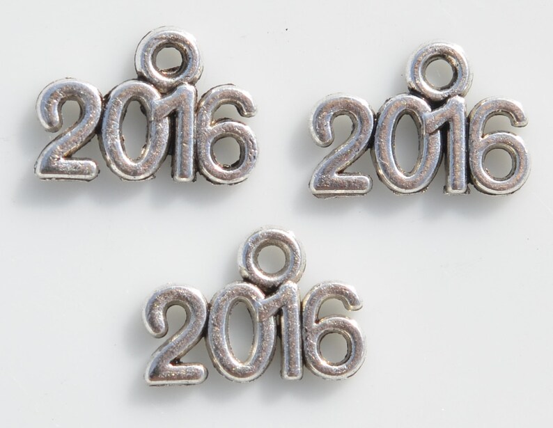 BULK 50 Year 2016 Silver Tone Charms SC2402