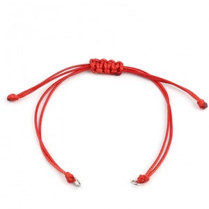 May include: A red string bracelet with a knotted design and silver metal clasps.