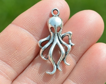 May include: Silver octopus charm with a loop at the top for attaching to jewelry or other crafts.