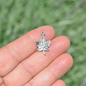 BULK 50  Maple Leaf Silver Tone Charms SC2417