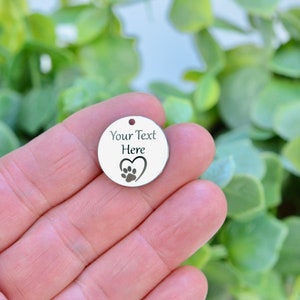 Personalized Stainless Steel 20mm Charm with a heart and paw print, Laser Engraved, Choose Your Font, and Quantity CC253