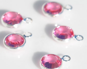 A GRANEL 10 Encantos de 6 mm con canal de piedra natal chapado en plata Swarovski rosa clara SC2375