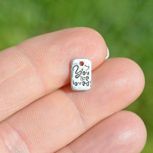 BULK 50  &quot;You Are Loved&quot; Silver Tone Charms SC3355