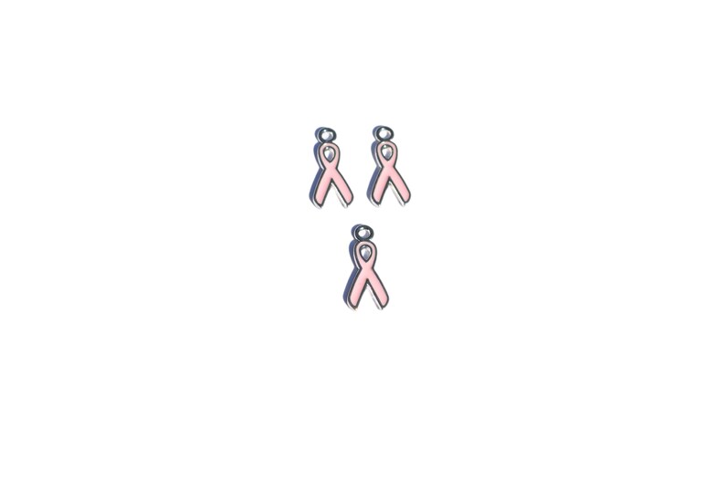 May include: Three pink ribbon charms with a silver finish. The charms are designed to be used for jewelry making.