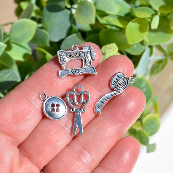 12 Mixed Piece  Sewing Set, Sewing Machine, Scissors, Tape Measure, Needle, Thread, Buttons, Silver Tone Tool Charms SC6985