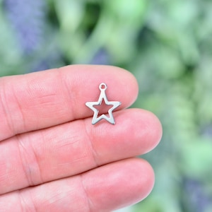 BULK 40 Silver Star Charm Pendant 17x15mm by TIJC SP0576B BULK 40 Silver Star Charm Pendant 17x15mm by TIJC SP0576B