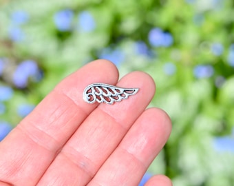 10  Wing Silver Tone Charms SC4246